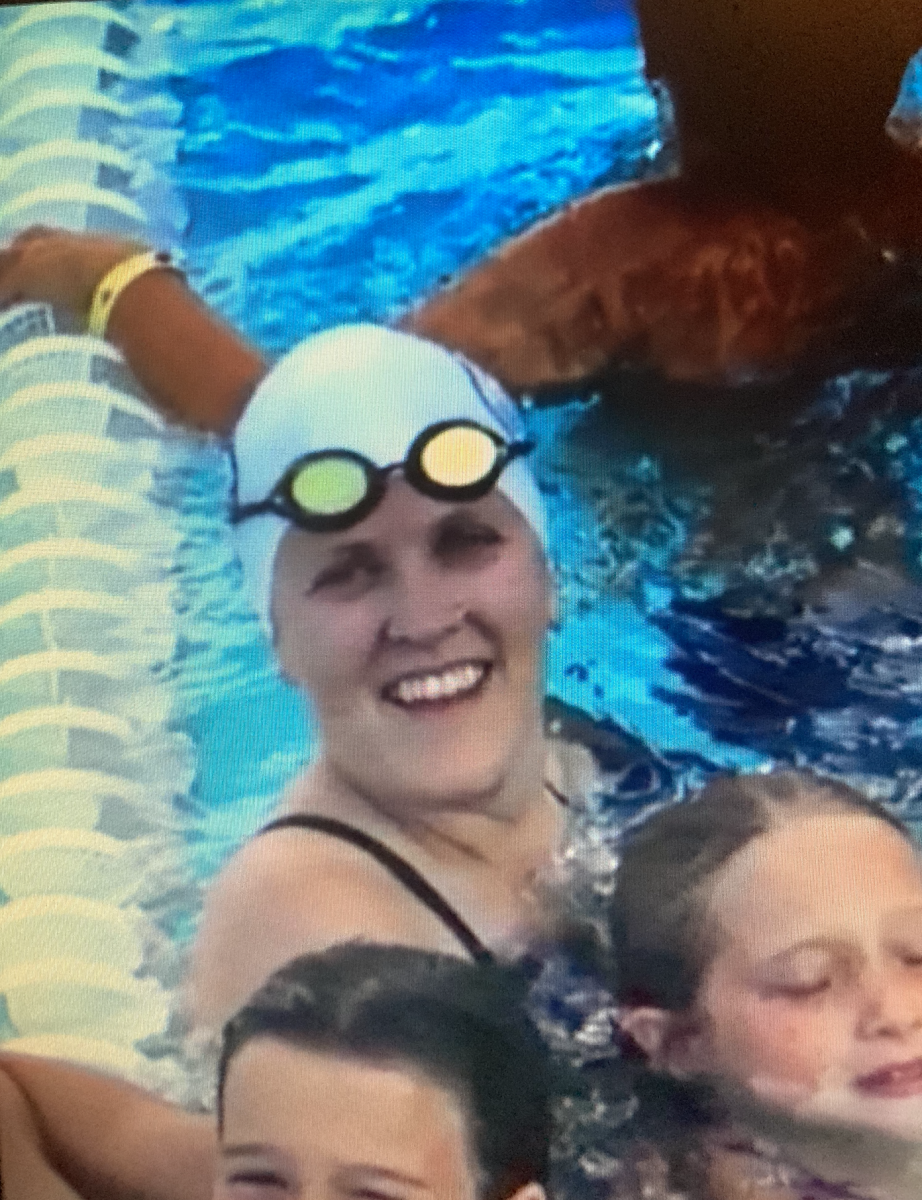 Kelly n the water with her swimmers at Shore and Country