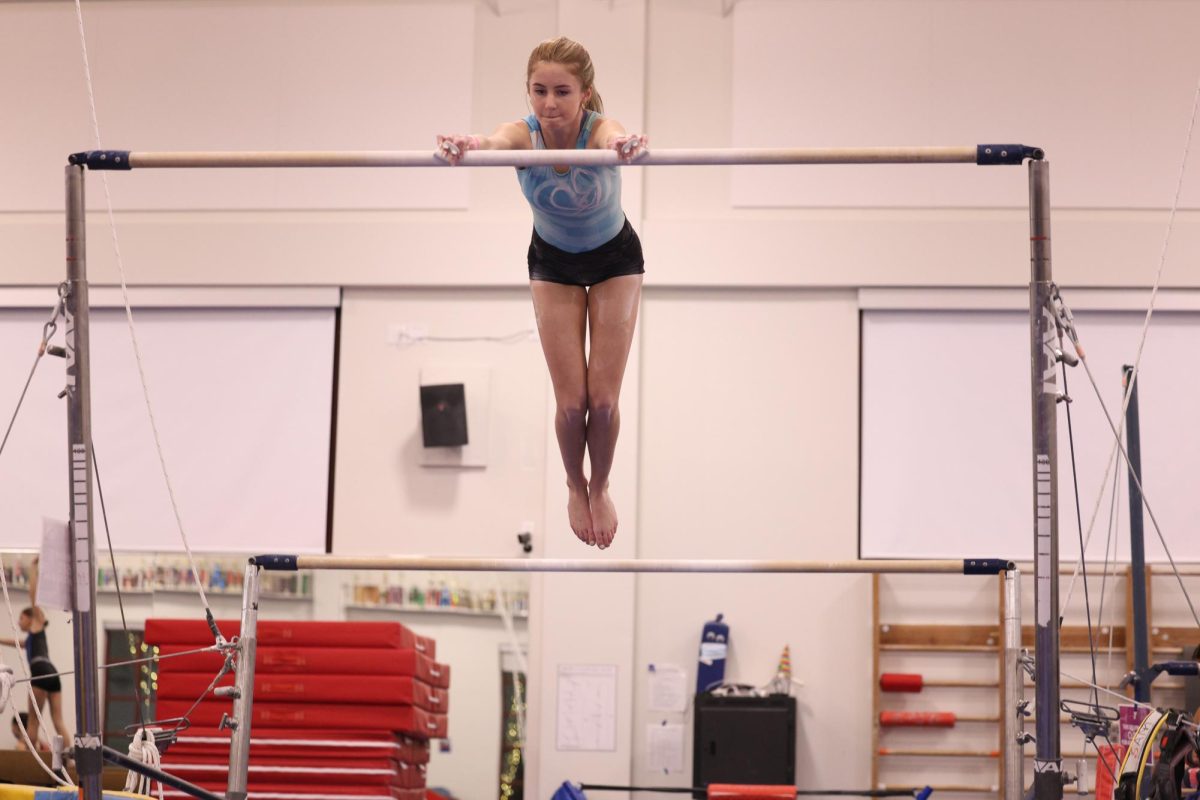 Hoffman practicing her bars routine 