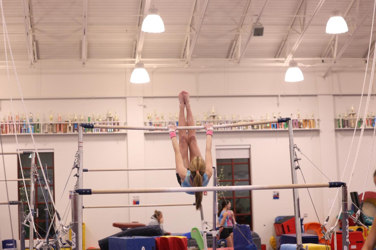 Hoffman practicing her bars routine 